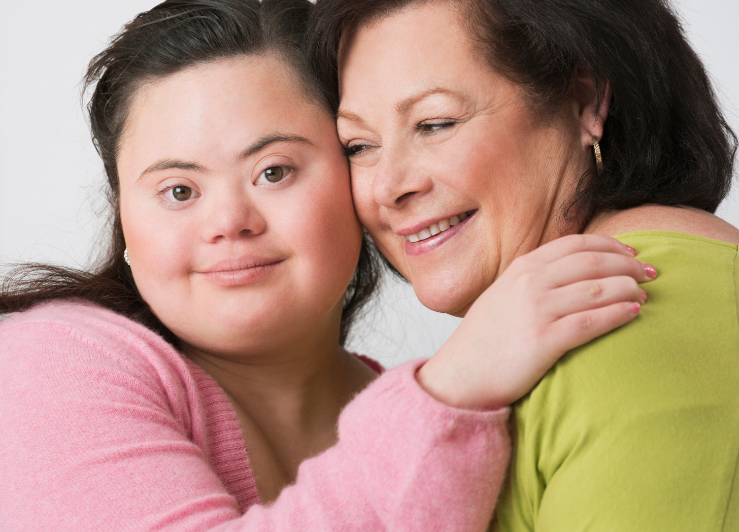 A young woman with Down syndrome and her mother.