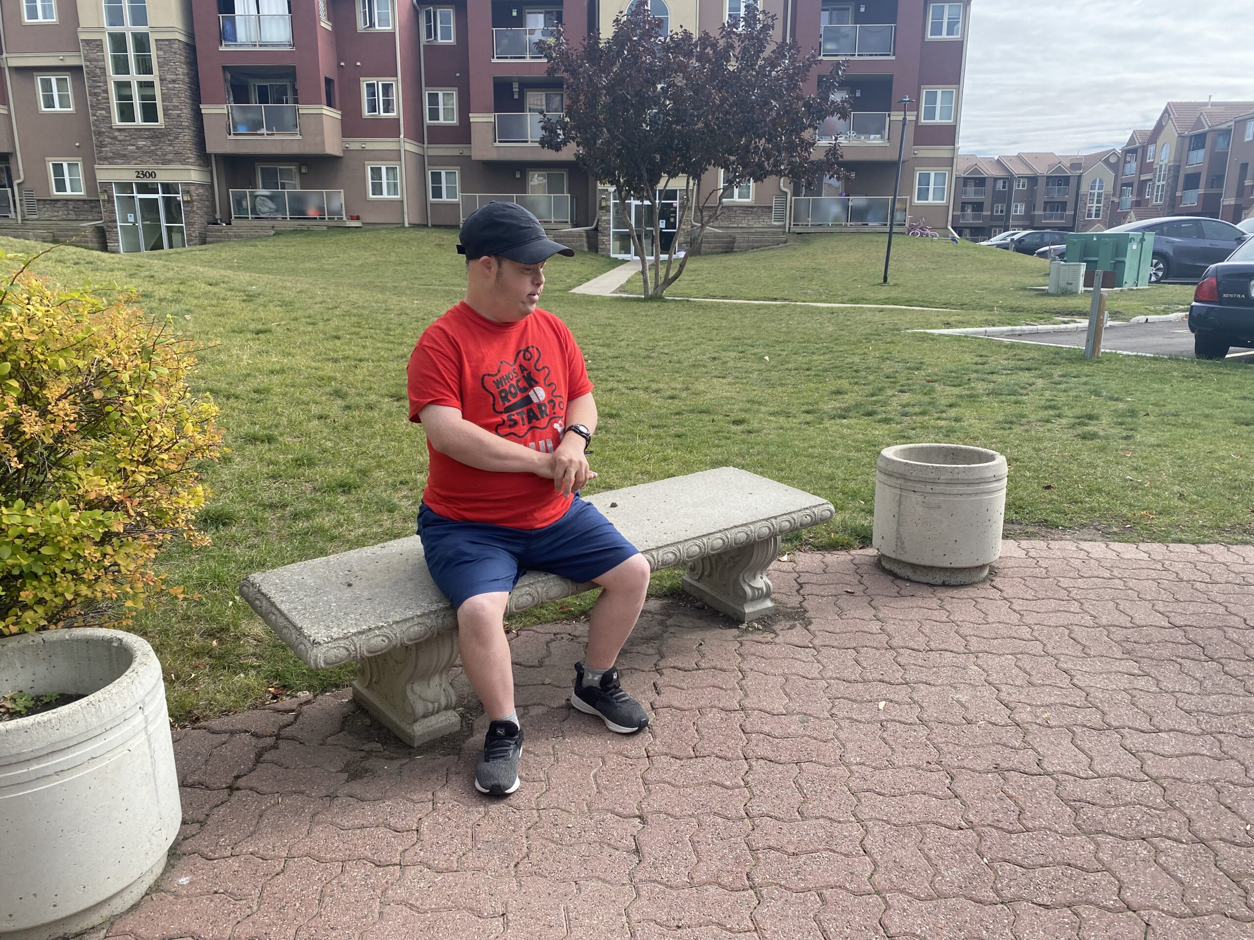 Paul sitting outside alone